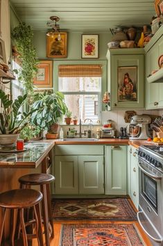 a kitchen filled with lots of green cabinets and counter top space next to a stove top oven