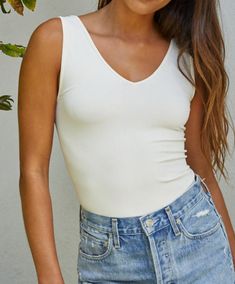 Whoever said basic is boring hasn't tried these tanks! This wide strap tank will go miles in your closet! Pair with a cardigan or jacket, or wear alone or as an activewear top. The stretchy fabric will contour your body in all the right places. 92% Nylon, 8% Spandex Wear it as a v-neck or scoop neck Colors may vary from different viewing devices Leopard Sneakers, Double Braid, Polka Dot Sweater, Star Sweater, Cute Fit, Studded Sandals, Striped Rompers, Cute Sweatshirts, Braided Strap