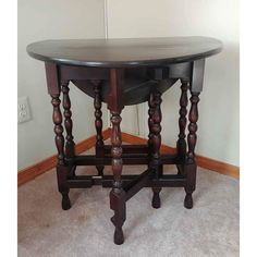 a wooden table sitting on top of a carpeted floor