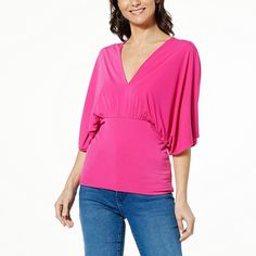 IMAN Global Chic Drape Knit Dolman Sleeve Top  Feminine, flattering and oh-so-fabulous, this draped knit top elevates your look and confidence all at the same time. Stretch Rayon V-neck Blouse, Flattering Stretch Tops, Pink Batwing Sleeve Top For Summer, Long Sleeve Rayon Stretch Tops, Versatile Pink V-neck Top, Pink Batwing Sleeve Tops For Spring, Summer Drapey Top With Batwing Sleeves, Summer Batwing Sleeve Drapey Top, Summer Drapey Batwing Sleeve Tops