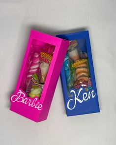 two pink and blue boxes filled with toys