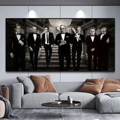 a group of men in tuxedos are standing on the stairs canvas wall art