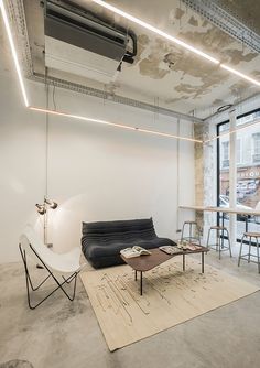 a living room filled with furniture next to a window