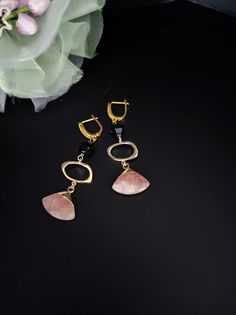 Strawberry quartz and black agate pendant earrings. The hooks are embellished with cubic zirconia and all metal components are premium quality, 18K gold plated. The earrings are long, simple but very elegant. Perfect for every day but also with a beautiful evening dress. You cannot miss the radiant beauty that emanates from these gemstones, it is truly dazzling, particularly when the light catches the facets and truly comes to life. Strawberry Quartz is delicious and energizing. It is a one of a kind stone that emits some amazing vibrations that are possibly life changing. The basic meaning of Strawberry Quartz is that it is the stone of love. The rosy pink crystal energy embraces you with thoughtful affection. The power of love can alter even the darkest situations. This stone has an exce Gemstone Dangle Earrings For Evening, Elegant Linear Drop Earrings With Natural Stones, Elegant Drop Earrings With Natural Stones, Elegant Gemstone Linear Earrings As Gift, Elegant Onyx Earrings, Elegant Onyx Earrings For Party, Elegant Gold Linear Earrings With Natural Stones, Modern Natural Stone Earrings For Formal Occasions, Elegant Gold Hoop Earrings With Natural Stones