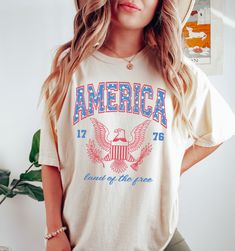 USA Shirt, Land of The Free T-Shirt, Comfort Colors®, America Flagshirt, Red White and Blue, Fourth of July, Patriotic Giftful, Merica Tee Our Unisex t-shirts are premium quality, SUPER soft and breathable, heavyweight, and 100% ring-spun cotton. We use Comfort Colors for our t-shirts and our customers love everything about them! FABRICATION: Unisex Garment-Dyed T-shirt Comfort Colors® 1717 * 100% ring-spun cotton * Heavyweight fabric (6.1 oz/yd² (206.8 g/m²) * Relaxed fit * Runs true to size SI Western Graphic Tees, Fourth Of July Shirts, Cowgirl Shirts, Oversized Graphic Tee, Free Tshirt, Country Shirts, Usa Shirt, Summer Bbq, Cow Girl