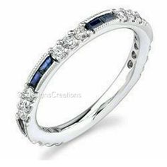 an 18k white gold diamond and sapphire band