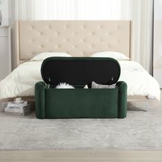 a bed with a green storage box underneath it