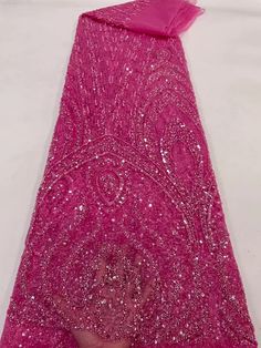 This high quality Fabric is measured in 5 Yards With Embroidered Beading and Sequin. It is soft, very delicate and beautiful. This high Quality Fabric is made with Fashion embroidered rhinestones can be used in making party wedding dresses, skirts, shawls, scarves and other other fashion apparels as you would like. Size : Length : 5 yards (180 inch). Width: 50 inch (Please allow slight deviation for the measurement data ,±1 inch) Material: 100% Polyester, Tulle Lace Fabric, Eco-Friendly embroide Beaded Lace Fabric, African Lace, Sequin Beading, Tulle Lace, Fabric Trim, Beaded Lace, Color Rosa, Fashion Fabric, Wedding Party Dresses