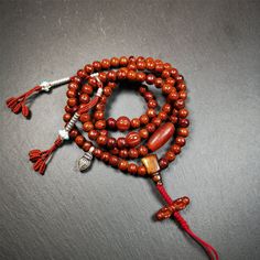 ❤This bodhi beads mala is made by Tibetan craftsmen and come from Hepo Town, Baiyu County, the birthplace of the famous Tibetan handicrafts,about 30 years old, hold and blessed by a lama in Baiyu Monastery.It is composed of 108 bodhi seed beads, and is equipped with 3 agate beads, silver bead counters are installed on both sides, 1 mani jewel bead clip,and finally consists a bone guru bead and vajra on the end, very elegant.❤Details1. Handmade 108 bodhi beads approximately 8mm,mala's perimeter i Spiritual Wooden Beads Jewelry For Meditation, Holistic Wooden Beads Mala For Rituals, Spiritual Mala With 108 Beads For Blessing, Holistic Wooden Mala For Rituals, Spiritual Brown Mala For Healing, Artisan Mala With Round Beads For Meditation, Bohemian Mala With 8mm Beads For Blessing, Bohemian 108 Beads Mala For Blessing, Artisan Adjustable Mala With 108 Beads