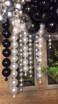 black and white balloons hanging from the ceiling