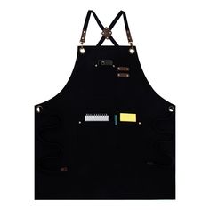 a black apron with yellow and green patches on it's front, hanging from the side