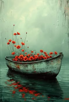 a boat filled with red flowers floating on top of water