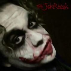 a close up of the face of a joker