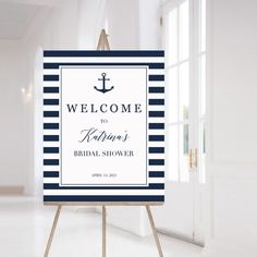 a welcome sign with an anchor on it for a bridal shower or wedding ceremony