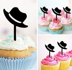 the cupcakes are decorated with hats and pink frosting