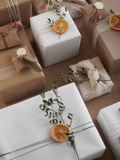 presents wrapped in white paper with orange slices on them