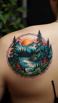 the back of a woman's shoulder with trees, mountains and water on it