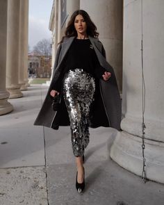 Discover a collection of dressy Christmas outfit ideas that you can recreate this winter with items that you already own, like a sequin skirt! Perfect for women who want to dress to impress during the party season, you'll find trendy holiday attire that are sure to make you stand out. For example, we just love this chic Christmas party outfit with a silver sequin midi skirt and a grey coat! Sequin Jacket Tulle Skirt, Black Sequin Skirt Boots, Skirts For Cocktail Party, Cheap Glamorous Skirt For Party Season, Winter Party Skirt, Silver Sequin Skirt Green Top, Sparkle Skirt Long, Sequin Skirt And Western Boots, High Waisted Sequin Skirt