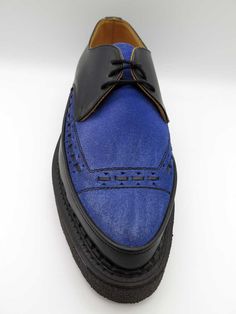 The original “Diano” creeper in black leather and blue suede, with Goodyear welted crepe sole. Made since the late fifties, reborn for the punk generation. V sole 24mm front, 36mm back. By George Cox, creator of the original Creeper shoe. Blue Cap Toe Oxfords For Derby, Blue Oxfords With Leather Sole For Derby, Blue Oxfords With Rubber Sole For Derby, Blue Low-top Oxfords With Brogue Detailing, Blue Low-top Oxfords With Rubber Sole, Blue Brogue Low-top Oxfords, Blue Wingtip Oxfords With Contrast Sole, Blue Cap Toe Leather Shoes For Derby, Blue Wingtip Leather Shoes For Derby