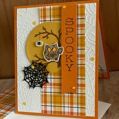 a card with an owl and spider on it