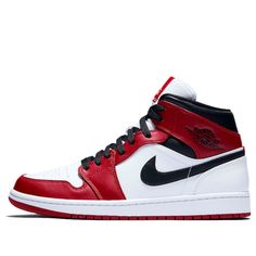 Dressed in the "Chicago" color scheme, this iteration of the Nike Air Jordan 1 Mid features the signature color-blocking of white, black and Gym Red. On the white leather upper are red overlays and black detailing, with an unconventional white heel. Leather Color Block Sneakers For Streetwear, Red Retro Leather Sneakers, Sporty White Sneakers With Contrast Color, White Sporty Sneakers With Contrast Color, Retro White Color Block Sneakers, White Casual Sneakers With Contrast Color, Casual White Sneakers With Contrast Color, Sporty Red Color Block Sneakers, Red High-top Sneakers With Contrasting Heel