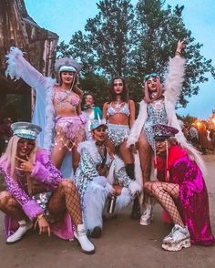 several women dressed in costumes posing for a photo