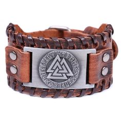 The Valknut is a symbol in Nordic mythology depicting three interlocked triangles. The three triangles and nine points of the Valknut are said to symbolize fertility, rebirth and reincarnation. The bracelet/wristband is made of soft leather and centerpiece is made from zinc alloy. Each metal charm is carefully polished in a smooth edge. Very comfortable to wear. The length is adjustable, the maximum length is about 270 mm (10.6 inches); the width is approximately 40 mm (1.42 inches). Fits wrist: Punk Braids, Viking Arm Rings, Nordic Runes, Viking Men, Bracelet Viking, Brown Leather Bracelet, Viking Bracelet, Viking Runes, Wristband Bracelet