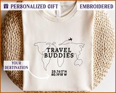 Show Your Affection for Traveling with Our Bella Canvas Embroidered T-Shirt Featuring a Unique "Travel Buddies" Design.  This Bella Canvas t-shirt for adults features an embroidered "Travel Buddies" text with a world map outline and an airplane, making it a perfect gift for travel enthusiasts. Ideal for those who love to explore, this cozy and stylish shirt is designed for comfort and style. Whether you're looking for a thoughtful travel-themed gift or a custom t-shirt, this top combines comfort Map Shirt Design, Travel T Shirt Design, World Map Outline, Travel Themed Gifts, Travel Buddies, Travel Tshirt, Map Outline, Unique Travel, Stylish Shirt