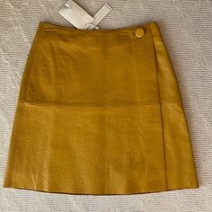 Yellow Leather Skirt. Never Worn. Spring Formal Leather Mini Skirt, Designer Leather Skirt For Work, Luxury Spring Workwear Skirt, Elegant Yellow Skirt For Workwear, Chic Yellow Lined Skirt, Chic Yellow Mini Skirt For Work, Chic Yellow Knee-length Skirt, Relaxed Yellow Knee-length Skirt, Yellow Leather Skirt