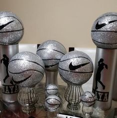 several silver basketballs sitting on top of each other