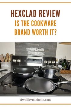 a black stove top with pots and pans sitting on it's burners