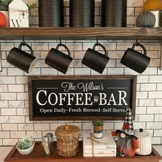 there is a coffee bar with cups on the shelf