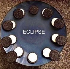 a plate with oreo cookies and the word eclipse on it