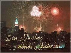 fireworks in the sky over a city at night with caption that reads, en frohes news saar