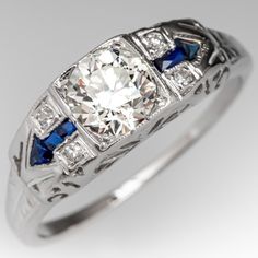 a diamond and blue sapphire ring with an old - fashioned style design on the side