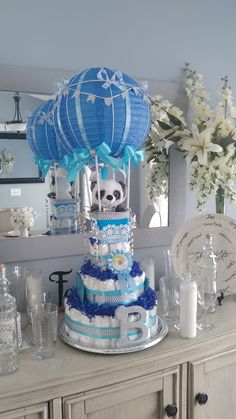 a blue and white cake sitting on top of a table