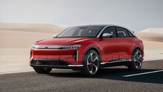 an electric car is driving on the road in front of some sand dunes and desert