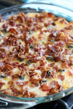 a casserole dish with bacon and cheese on top