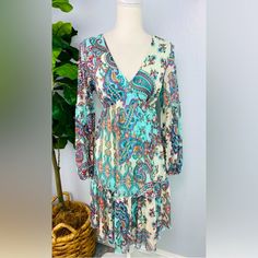 Excellent Condition! Size 6 Never Worn!!! Sleeves Are Long Sheer Cuffed Bell Sleeves Body Of Dress Is Lined Very Stretchy And Airy Spring Paisley Print Boho V-neck Dress, Spring V-neck Boho Dress With Paisley Print, Paisley Print V-neck Patterned Dress, Spring Blue Paisley Print Dress, Patterned V-neck Paisley Print Dress, Bohemian Blue Mini Dress With Paisley Print, Blue Paisley Print V-neck Dress, V-neck Paisley Print Patterned Dresses, Blue V-neck Dress With Paisley Print