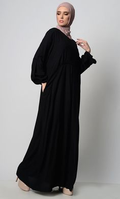 A perfect wardrobe piece for minimalistic style Simple and classy details A stylish abaya with a waist detail adding panel, gather and pleat Includes both side pockets Round neck basic style Full Sleeves FABRIC: Rayon CARE: Machine wash cold Solid Color Long Sleeve Abaya For Work, Long Sleeve Abaya For Work, Solid Color Maxi Length Abaya For Work, Solid Long Sleeve Abaya For Work, Solid Maxi Length Abaya For Work, Modest Solid Color Workwear Abaya, Modest Workwear Abaya In Solid Color, Modest Workwear Abaya, Fall Solid Color Maxi Length Abaya