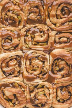 the pastry is covered in caramel sauce and has been cut into squares to look like cinnamon rolls