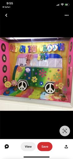 an image of a vw camper van with flowers and peace signs on it