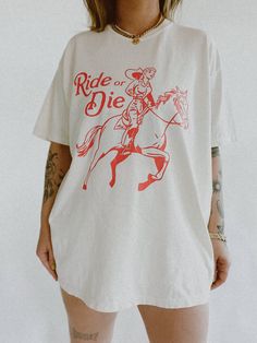 These tees are printed on super soft Comfort Colors, providing a relaxed unisex fit with a worn-in look and feel. This collection offers our most expanded size range from S-3X.Looking for these tees to fit oversized? Size up 1-2 sizes.Model has sized up to an XL for an oversized fit.• 100% ring-spun cotton• Garment-dyed• Relaxed fitThis product is made especially for you as soon as you place an order, please see the banner on the top of our site for current turnaround times. Making products on d Sport Style Outfits, Grunge Hippie, Oversized White Shirt, Outfit Streetwear, Summer Graphic Tee, Retro Graphic Tees, Women Encouragement, Ride Or Die, Western Cowgirl