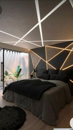 a modern bedroom with black and white lighting on the ceiling, bed in foreground