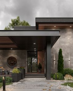 the front entrance to a modern home with stone steps leading up to it's entry