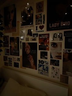 a wall covered with posters and lights