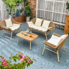 an outdoor patio with furniture and potted plants