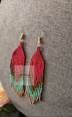 Colors: Red, Brown, Teal and Bronze Red Bohemian Beads For Crafting, Handmade Red Beaded Long Drop Earrings, Handmade Red Long Drop Beaded Earrings, Red Bohemian Teardrop Beaded Earrings, Artisan Red Beaded Earrings For Festival, Artisan Red Handmade Beaded Earrings, Red Teardrop Beaded Earrings With Dangling Beads, Red Teardrop Beaded Dangling Earrings, Red Beaded Earrings For Festival