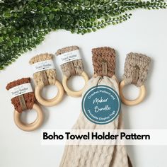 the boho towel holder pattern is made from natural wood and has five rings on each side