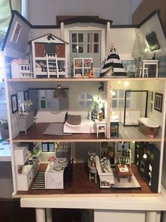 a doll house is shown with all the furniture and accessories in it's display case